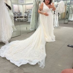 Brand new wedding dress. Size 18. Never worn with tags. Galina Signature